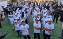أطفال فلسطينيون يشاركون في ماراثون بين أنقاض حي الأمل في خان يونس، بالتزامن مع إطلاق مبادرة محلية لدعم الأيتام، جنوب قطاع غزة، 31 يوليو/تموز 2026. تصوير: طارق محمد.
