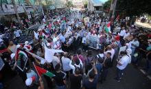 فلسطينيون يشاركون في احتجاج للمطالبة بإسترداد جثامين الشهداء الذين يحتجزهم الجيش الاسرائيلي في اليوم الوطني لاسترداد جثامين الشهداء.jpg