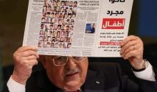 ابو مازن يرفع صورة لشهداء غزة الاطفال في الامم المتحدة.jpg