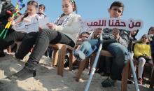 تدشن منحوتة رملية لأطفال غزة الجرحى على شاطئ البحر 67.jpeg