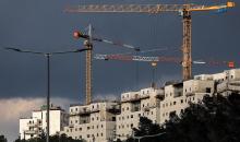 أعمال بناء في مستوطنة  رامات شلوم  المقامة على أراضي بلدة شعفاط في القدس المحتلة (أرشيف - أ ف ب).jpg