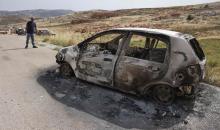 مستوطنون يحرقون مركبات وممتلكات المواطنين في قرية المغير شرق رام الله .. تصوير (الفرنسية) 88.jpg