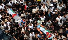 آلاف الفلسطينيين يشيعون جثماني الرفيقين مقبول وشاهين.jpg