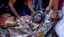 امرأة فلسطينية مصابة بعد انتشالها من تحت أنقاض منزل.webp