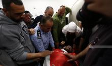 وداع الشهيد الشاب عودة عاطف عواودة في مجمع فلسطين الطبي برام الله (تصوير..حمزة شلش-وفا).jfif