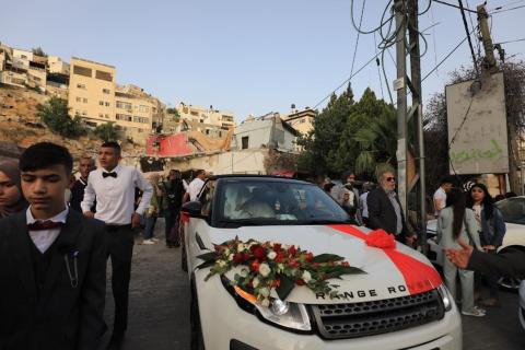 القدس - عائلة الرجبي في حي عين اللوزة ببلدة سلوان جنوب المسجد الاقصى، تزف ابنتها عروسا فوق أنقاض منزلها -  تصوير - وفا