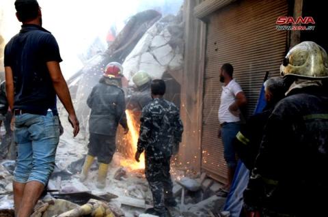 وفاة عشرة أشخاص وإنقاذ طفل وامرأة من تحت أنقاض بناء مخالف في حلب.jpg