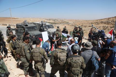 فلسطينيون يشاركون في مسيرة ضد الاستيطان في قرية يطا جنوب مدينة الخليل 11(1).jpg