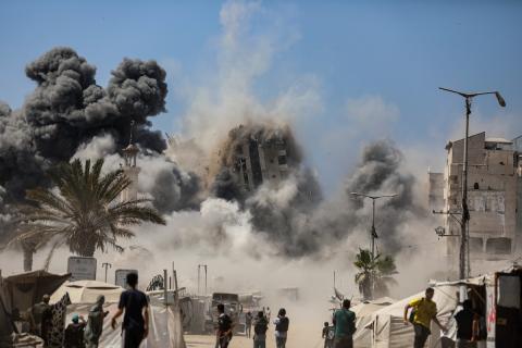 Smoke billows during Israeli strikes on tall building in Gaza City on September 5, 2025,