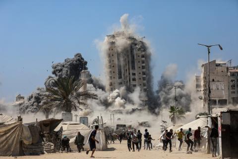 Smoke billows during Israeli strikes on tall building in Gaza City on September 5, 2025,