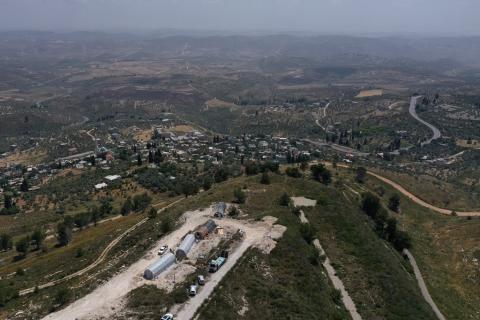 صورة جوية تظهر بلدة برقة شمال غرب نابلس وأعمال بناء في موقع مستعمرة  حومش  (تصوير أ ف ب).jpg