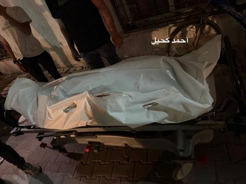 وصول شهيد الى مجمع الشفاء الطبي.jpg