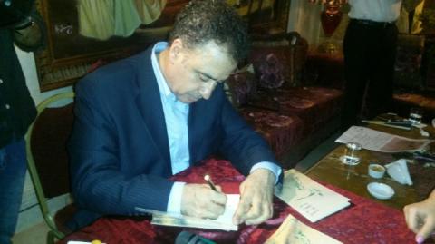 توقيع متناغم لكتاب غسان علم الدين (أخضر في سهول الجراد)
