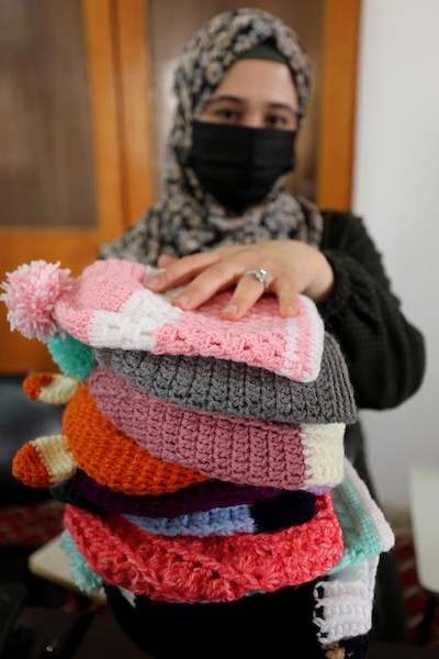 مبادرة فلسطينية لتوزيع الملابس الصوفية على الفقراء في فصل الشتاء 4