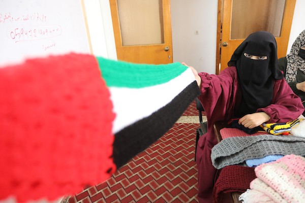 مبادرة فلسطينية لتوزيع الملابس الصوفية على الفقراء في فصل الشتاء 8