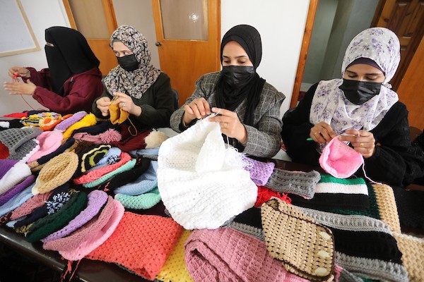 مبادرة فلسطينية لتوزيع الملابس الصوفية على الفقراء في فصل الشتاء 10
