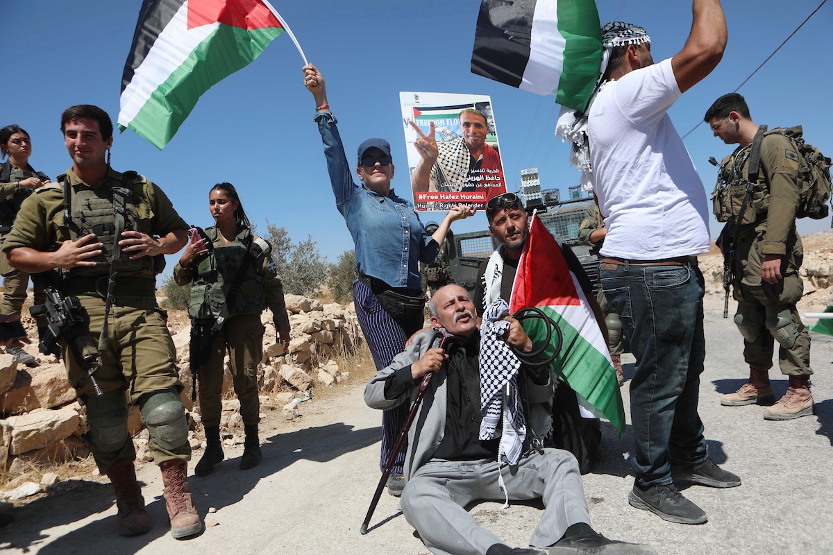 فلسطينيون يشاركون في مسيرة ضد الاستيطان في قرية يطا جنوب مدينة الخليل 10.jpg