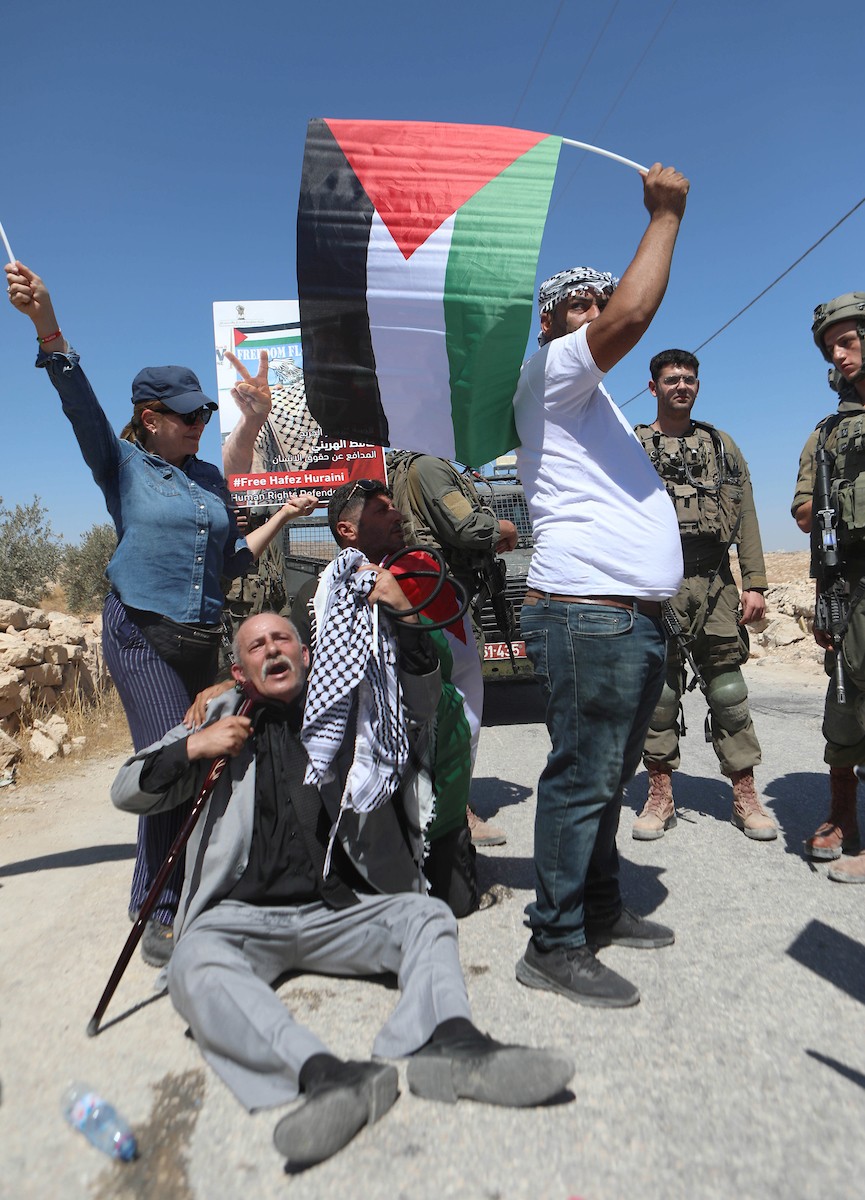 فلسطينيون يشاركون في مسيرة ضد الاستيطان في قرية يطا جنوب مدينة الخليل 17.jpg