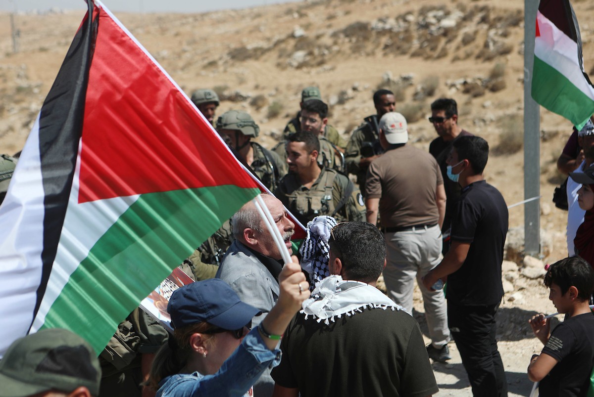 فلسطينيون يشاركون في مسيرة ضد الاستيطان في قرية يطا جنوب مدينة الخليل 15.jpg