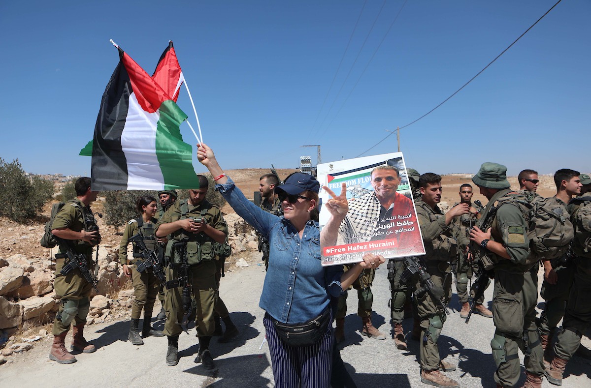 فلسطينيون يشاركون في مسيرة ضد الاستيطان في قرية يطا جنوب مدينة الخليل 16(1).jpg