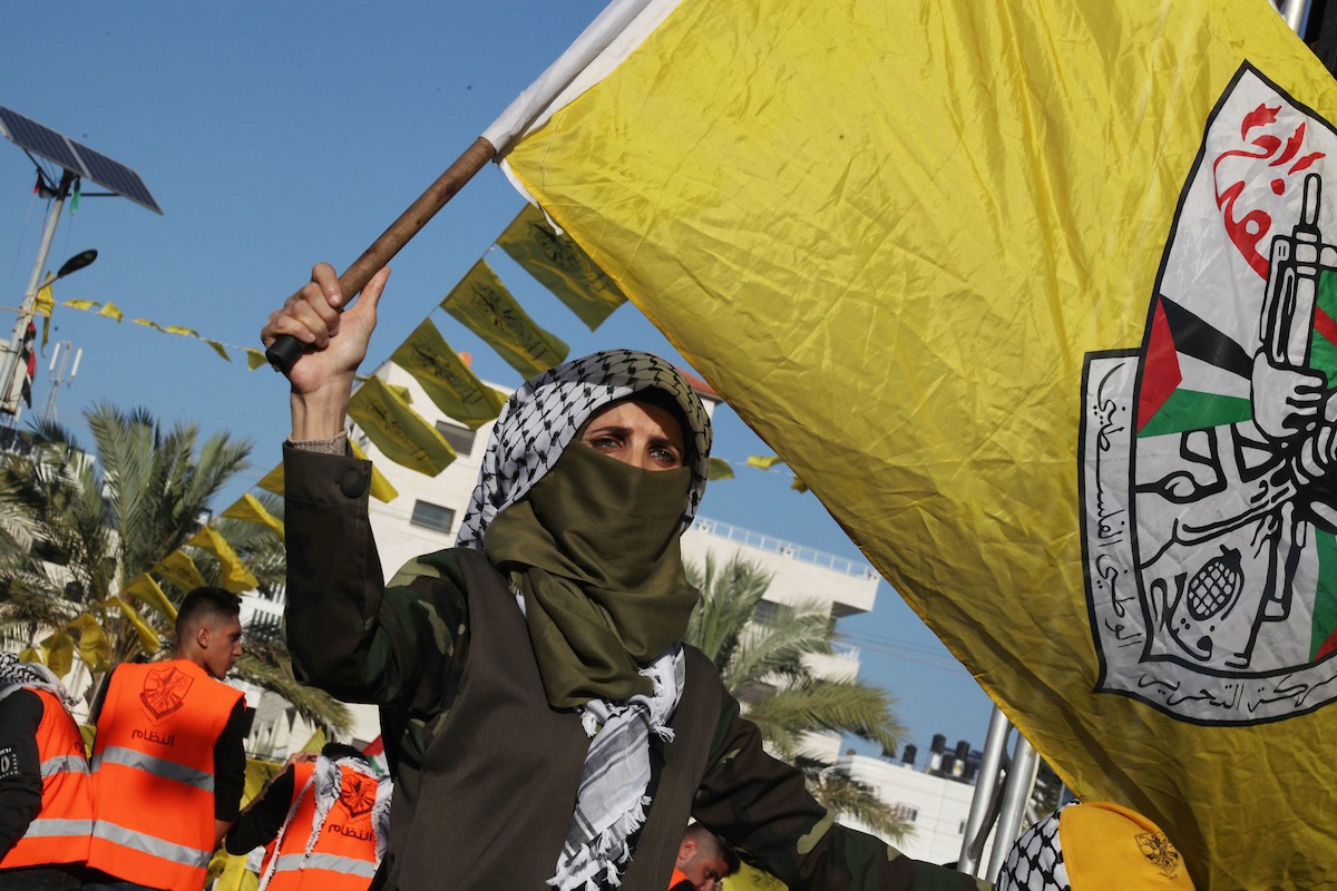 أنصار حركة فتح يشاركون في مهرجان مركزي في الذكرى الـ 18 لاستشهاد الرئيس الفلسطيني الراحل ياسر عرفات في غزة 34.jpg